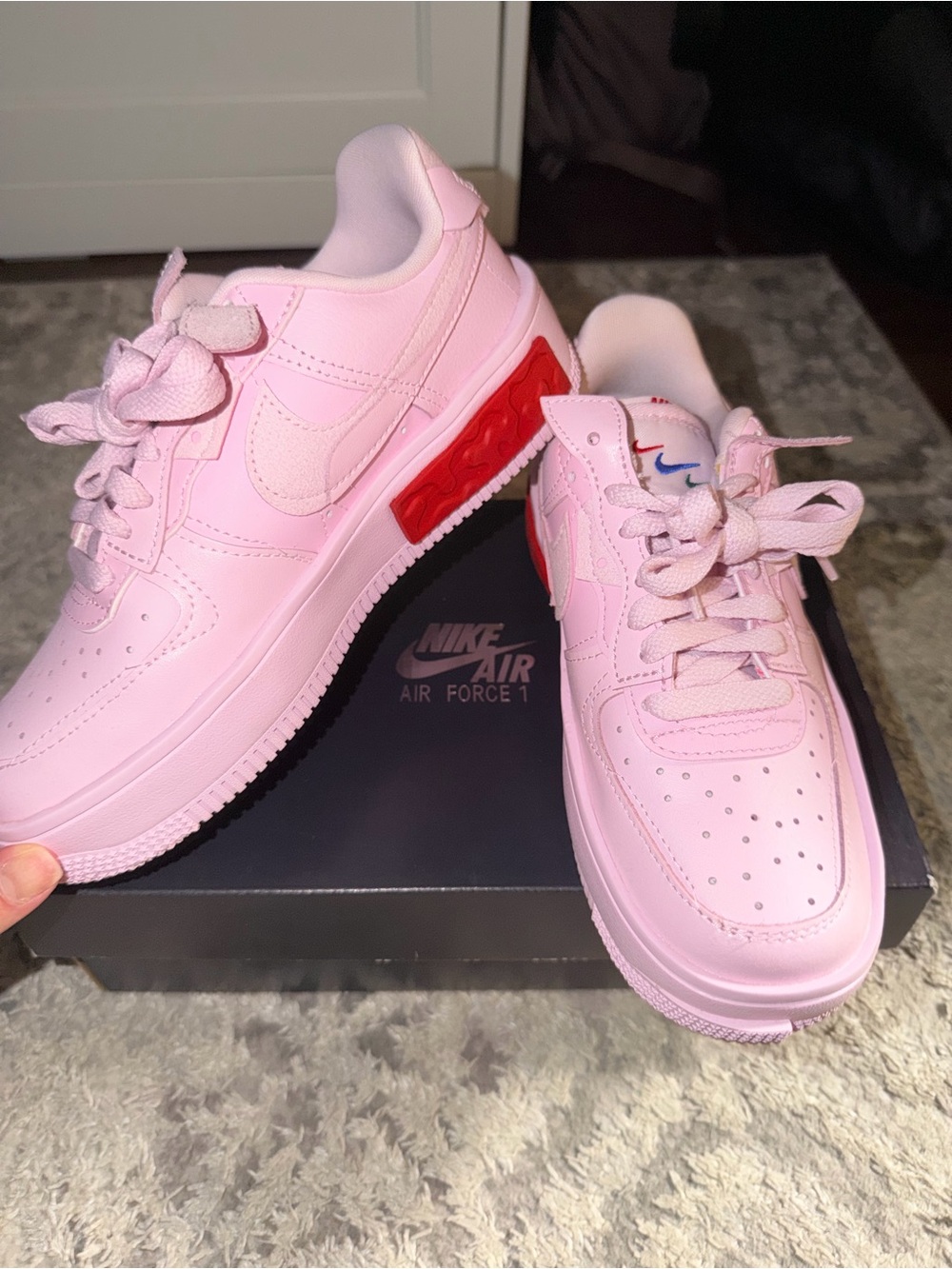 Nike Women’s Pink Sneakers with Red Heel Accent